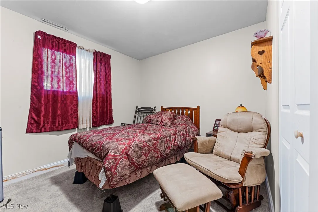 Bedroom featuring carpet and baseboards in lower level