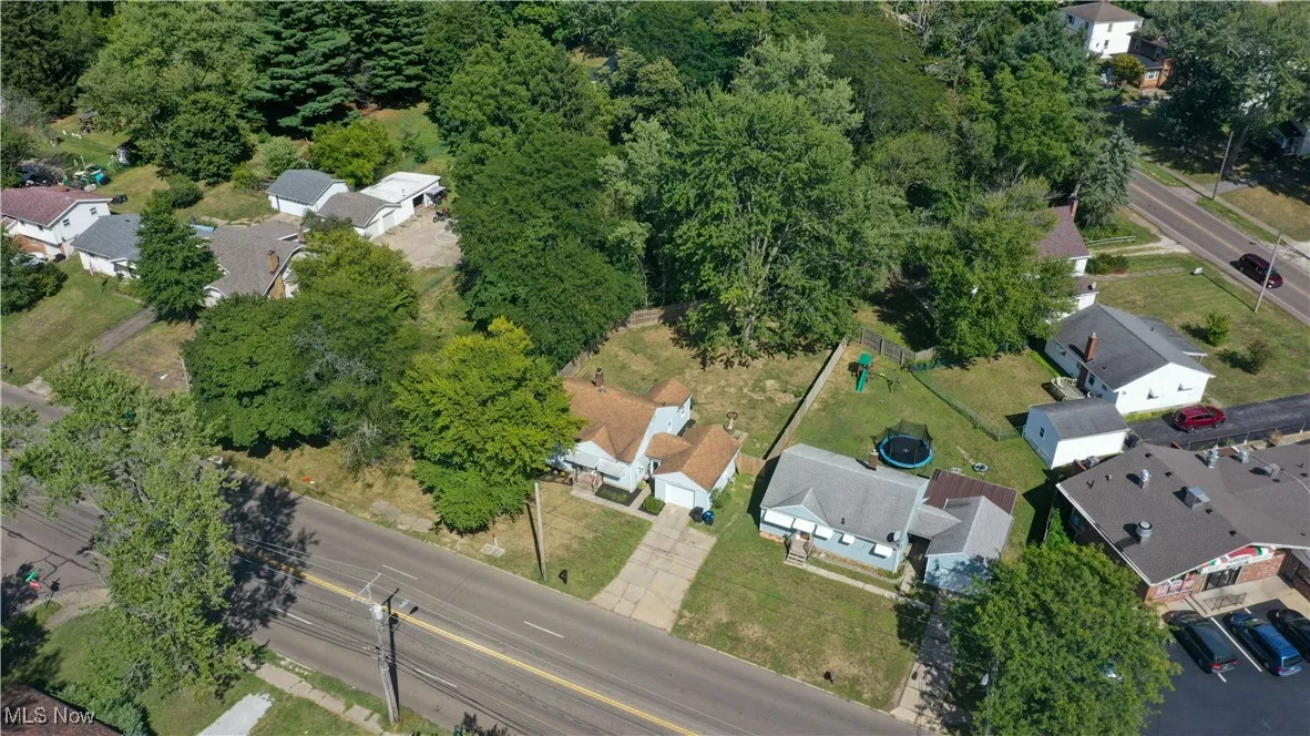 Aerial view of property's location with nearby suburban area
