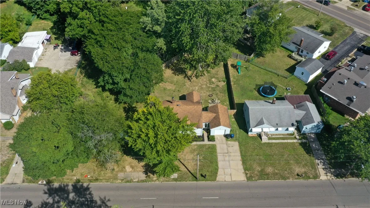 Aerial overview of property's location featuring nearby suburban area
