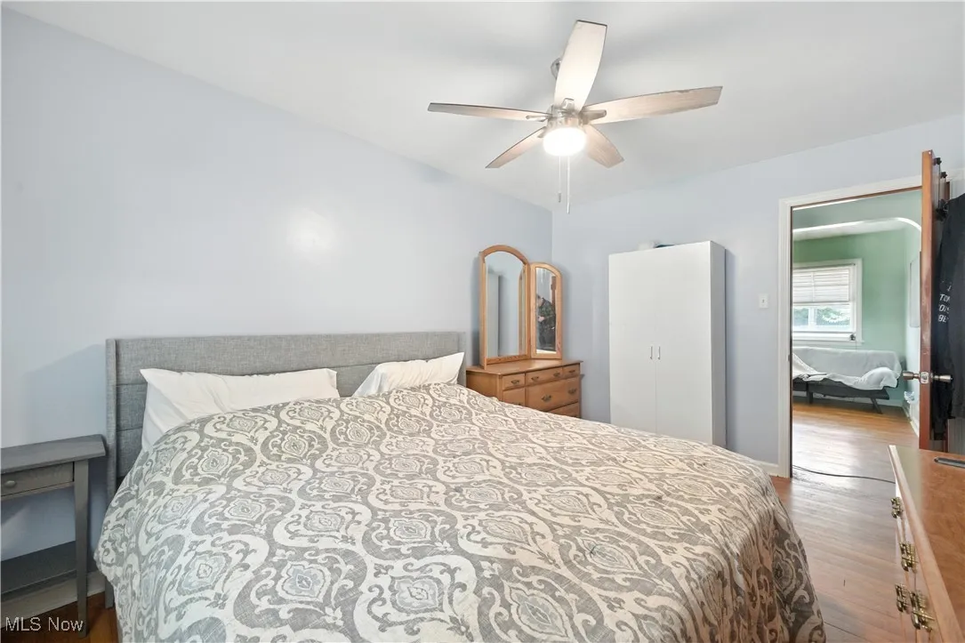 Bedroom featuring wood finished floors and a ceiling fan