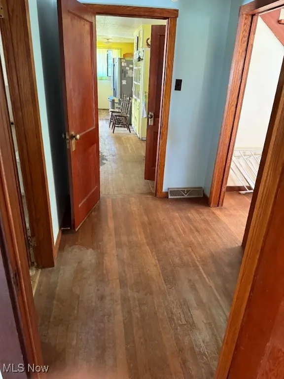 Hall featuring hardwood / wood-style flooring