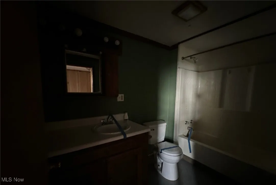 Bathroom featuring shower / tub combination and vanity