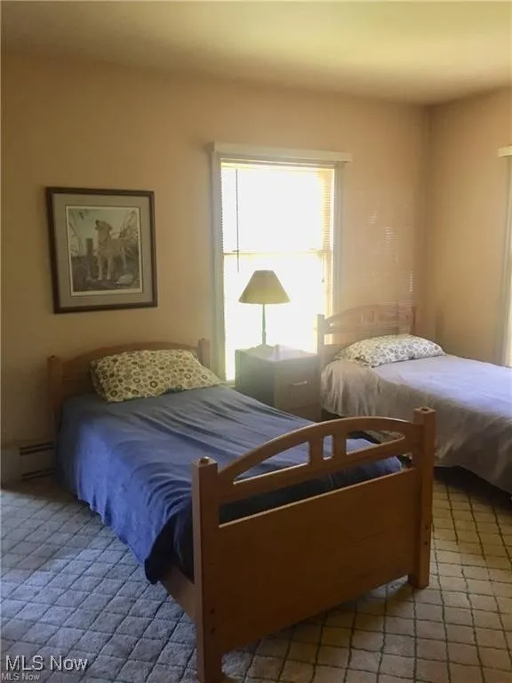 Bedroom featuring a baseboard radiator