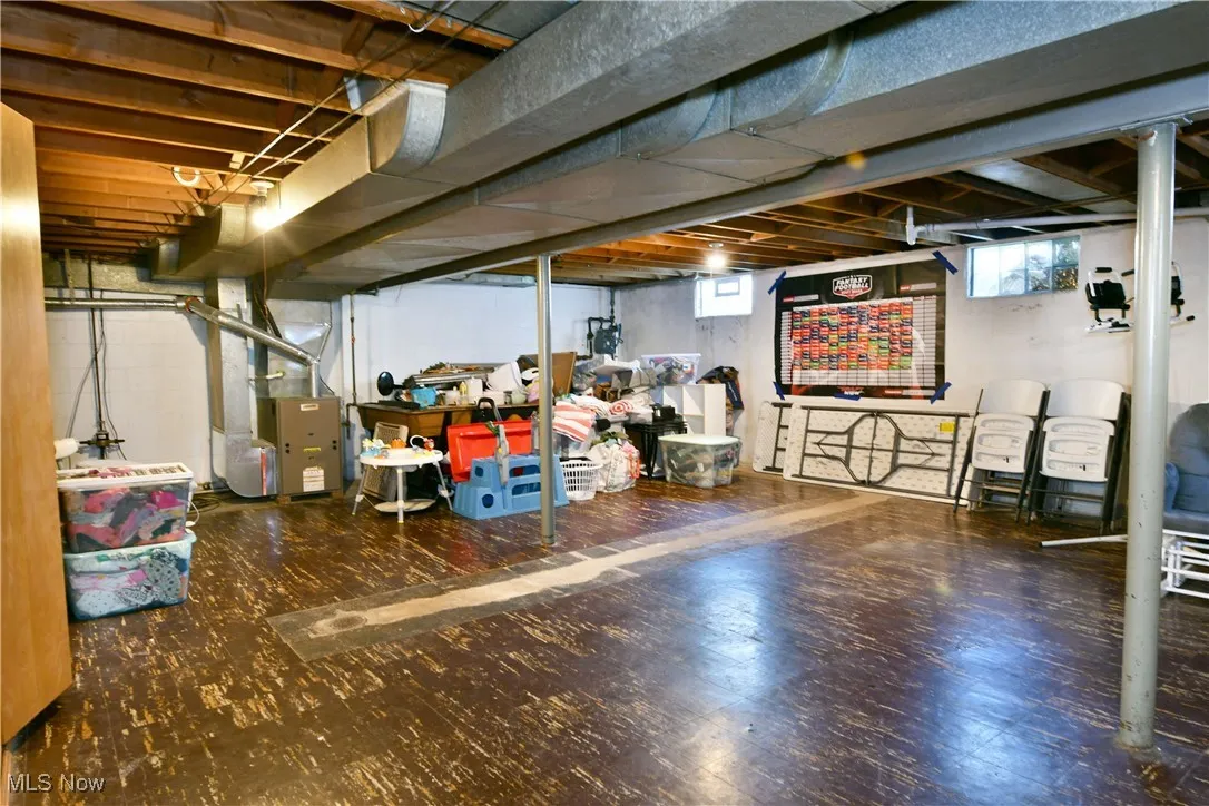Basement featuring heating unit