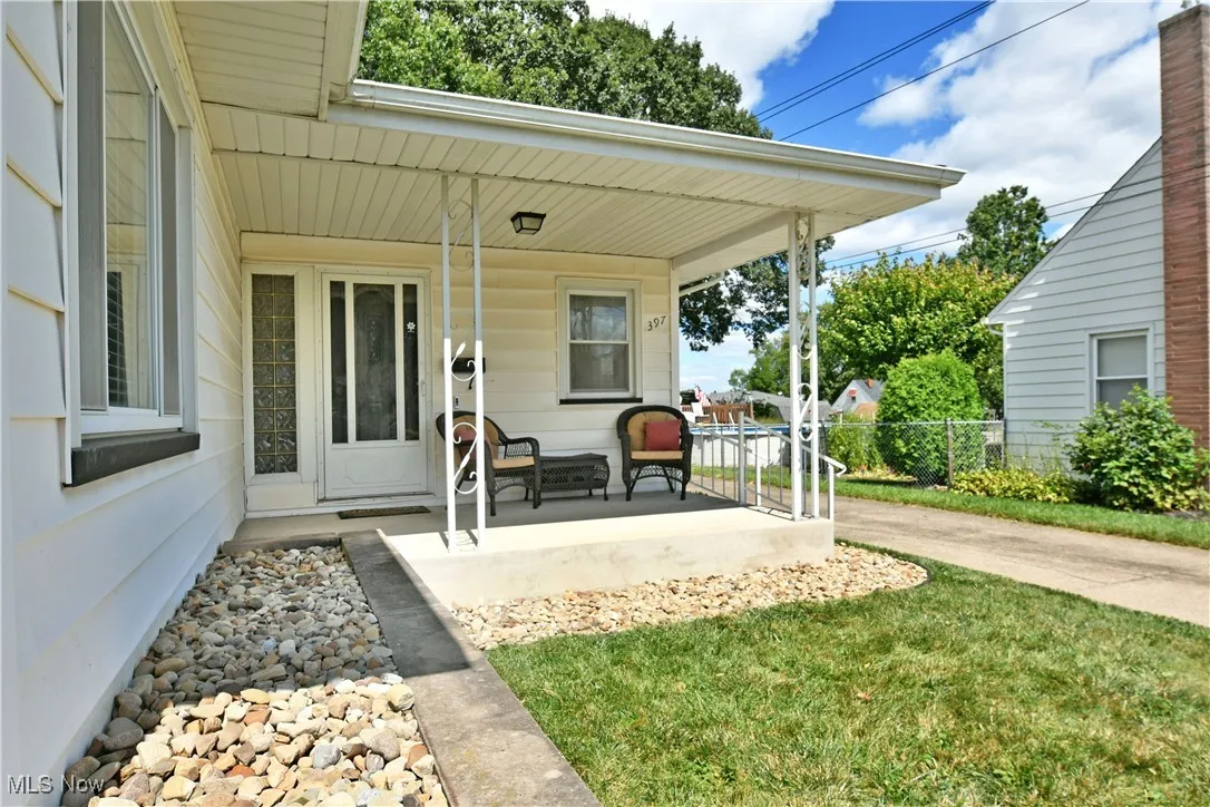 Entrance to property featuring covered porch