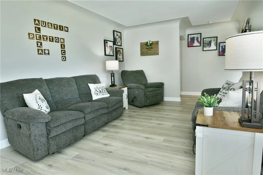 Living room with light wood-style flooring