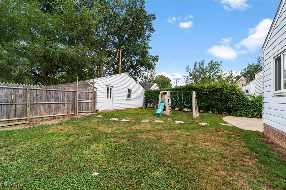 This is the back yard and shows a fenced yard and entry into your two car garage.