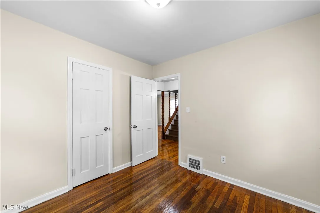 View of bedroom two  and the hardwood flooring and larger closet