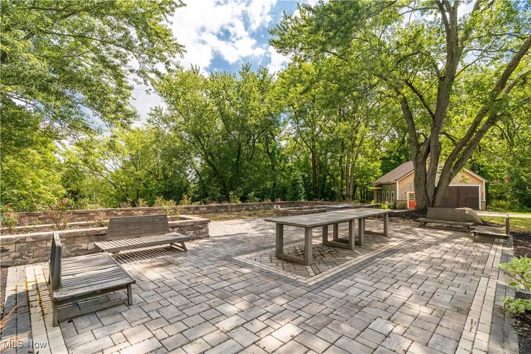 View of patio, bocce court and the workshop off the to side.