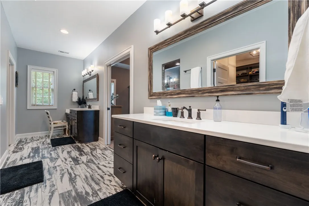 Master bath with separated vanities.