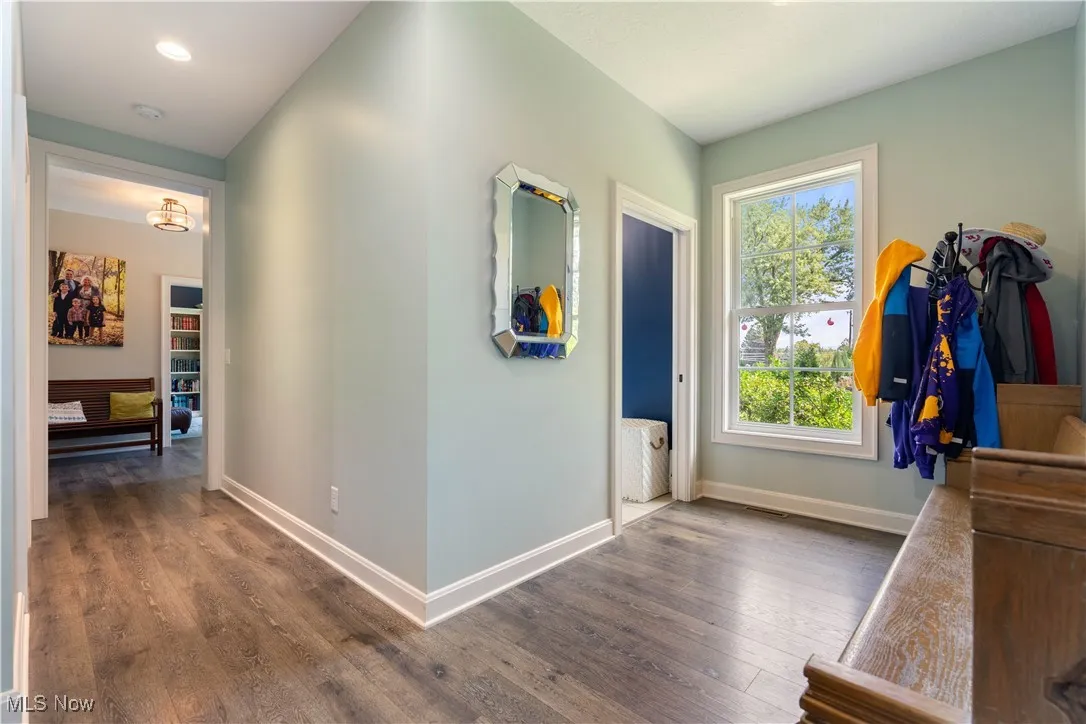 Spacious mud room area with the laundry room adjacent,