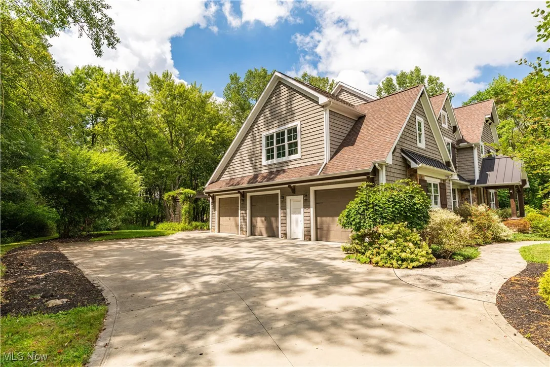 Loads of parking and storage with a long drivway and side entrance three car garage.