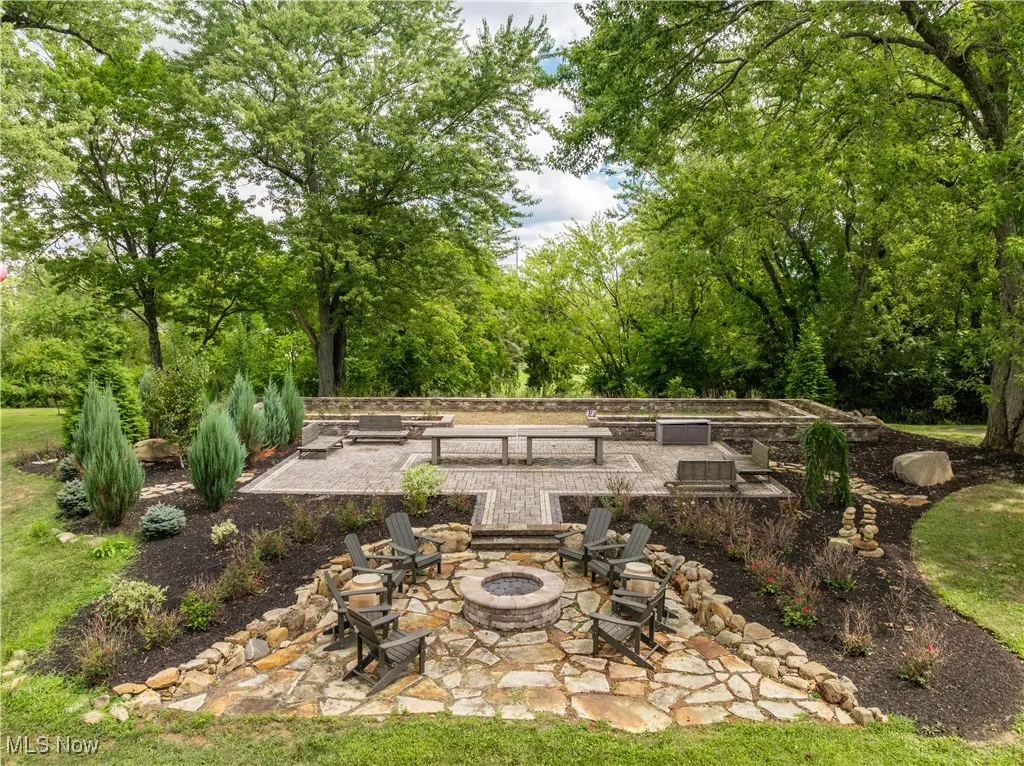 Outdoor entertaining is a breeze with this large raised patio off the firepit.