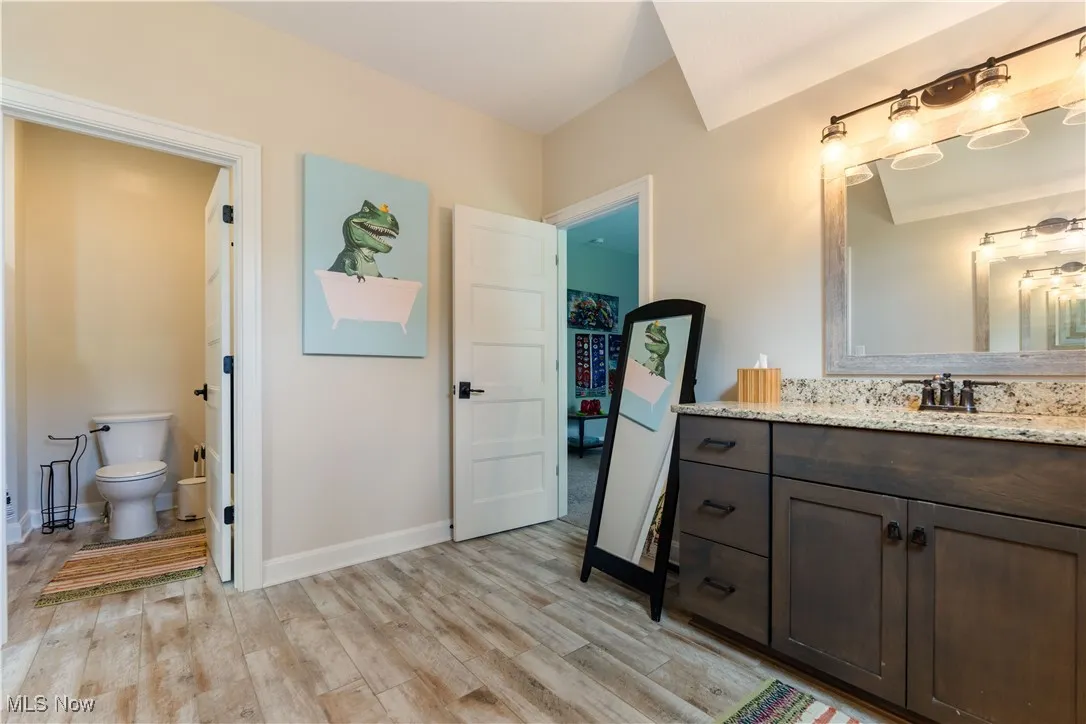 Full bathroom connecting two bedrooms on the second floor.