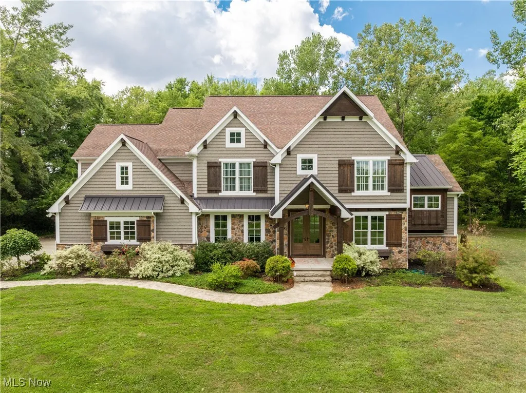 Five acres of luxury living in Jackson Twp at 5155 Fleetwood Ave NW.