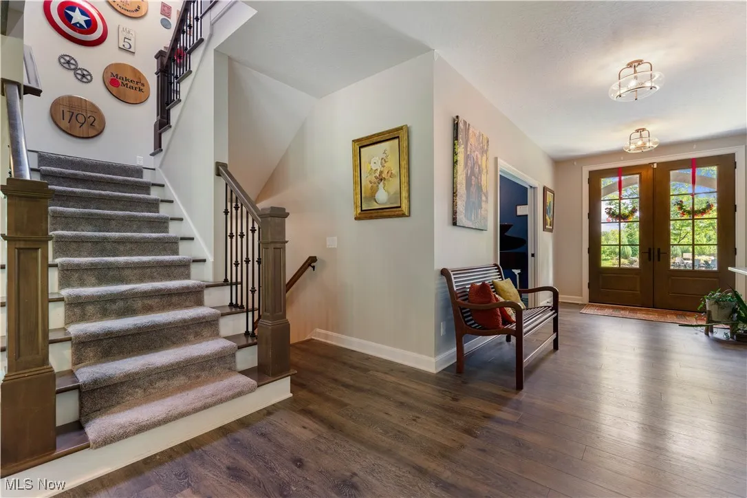 Bright and beautiful front foyer and stairway to the second level.