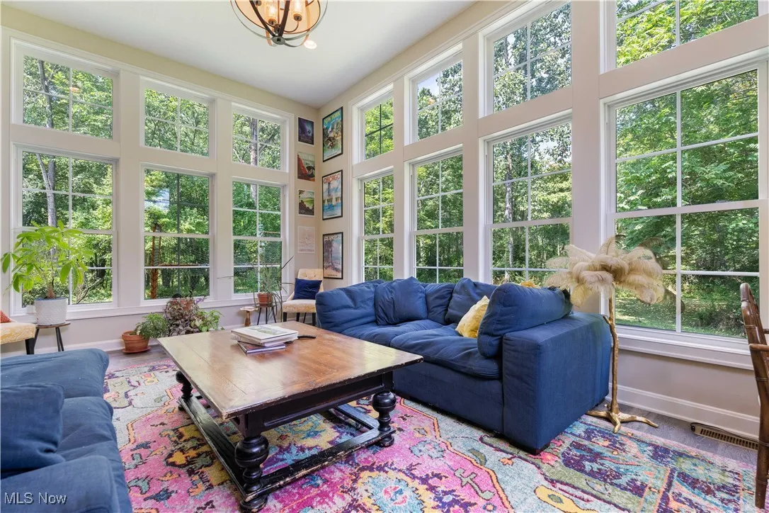 Wrap around corner windows allow the natural light to flow in to the sunroom.
