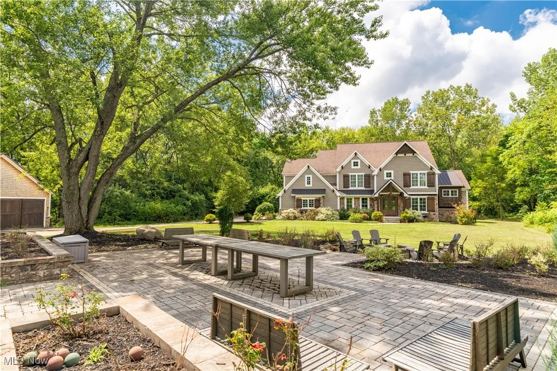 Front entertaining area with patio, firepit and bocce court.
