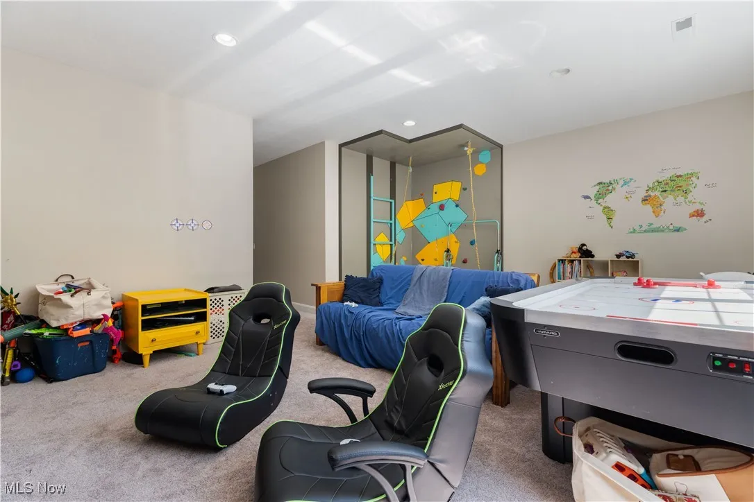 Recreation room on the second floor with a rock climbing wall (can be removed at buyers request).