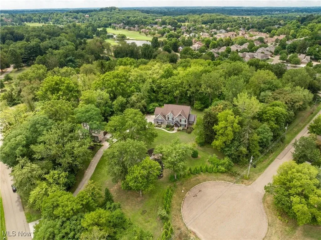 Aerial view of the five acre property and home.