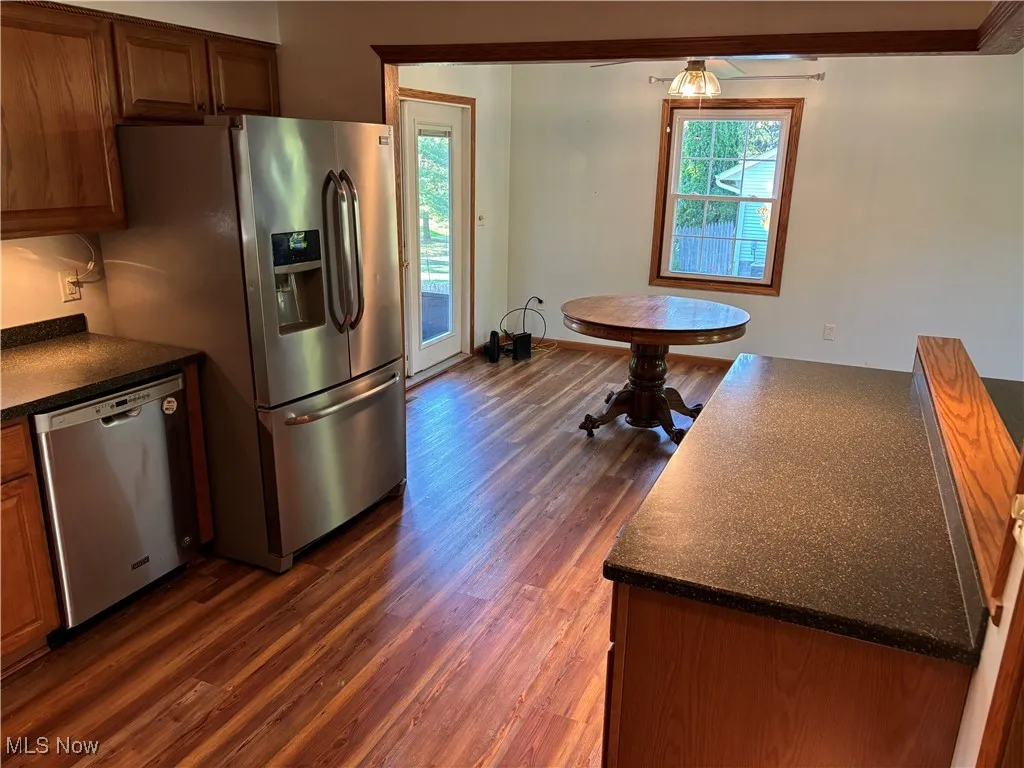 Kitchen view towards dining room and 3 season sunroom!