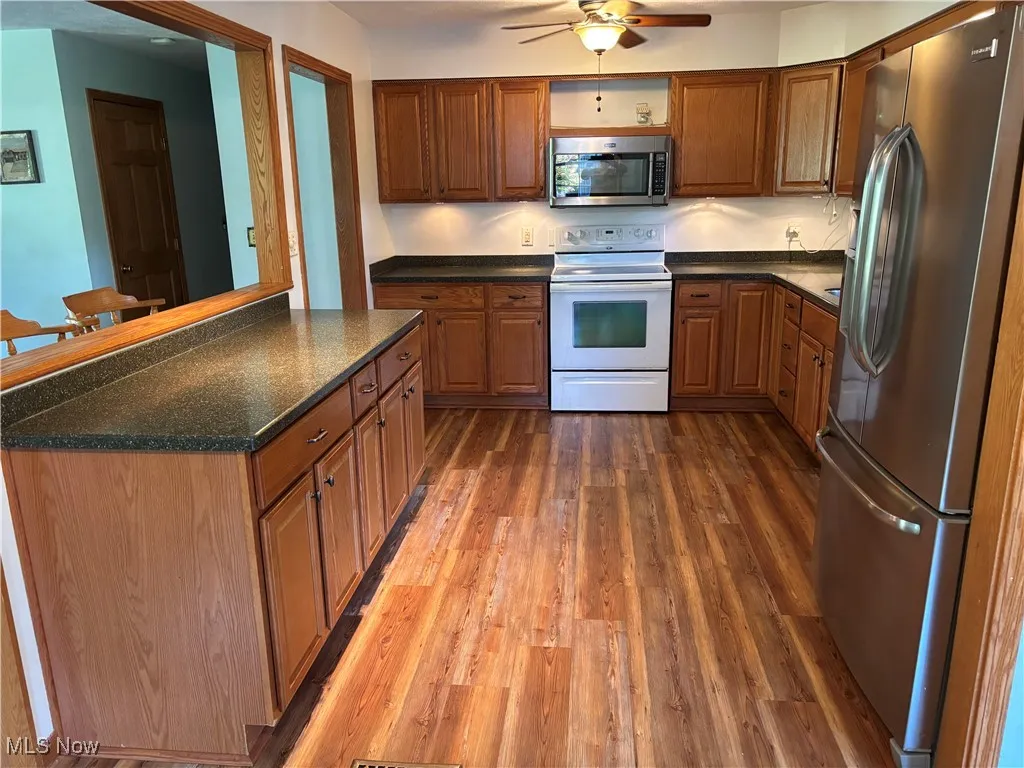 Open kitchen into living room, dining room.....ample storage down the hallway...pantry, coat closet, broom closet and linen closet