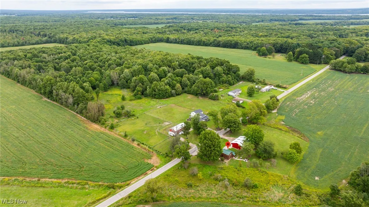 Aerial view of property and surrounding area with rural landscape