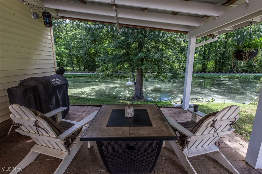 Sunroom with plenty of natural light and a water view