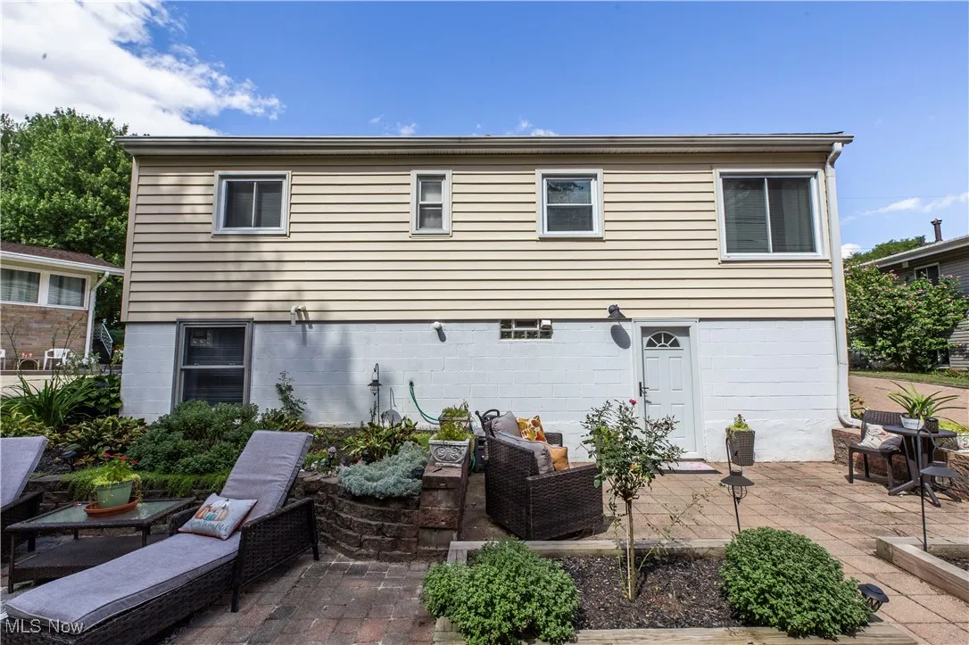 Rear view of property with a patio