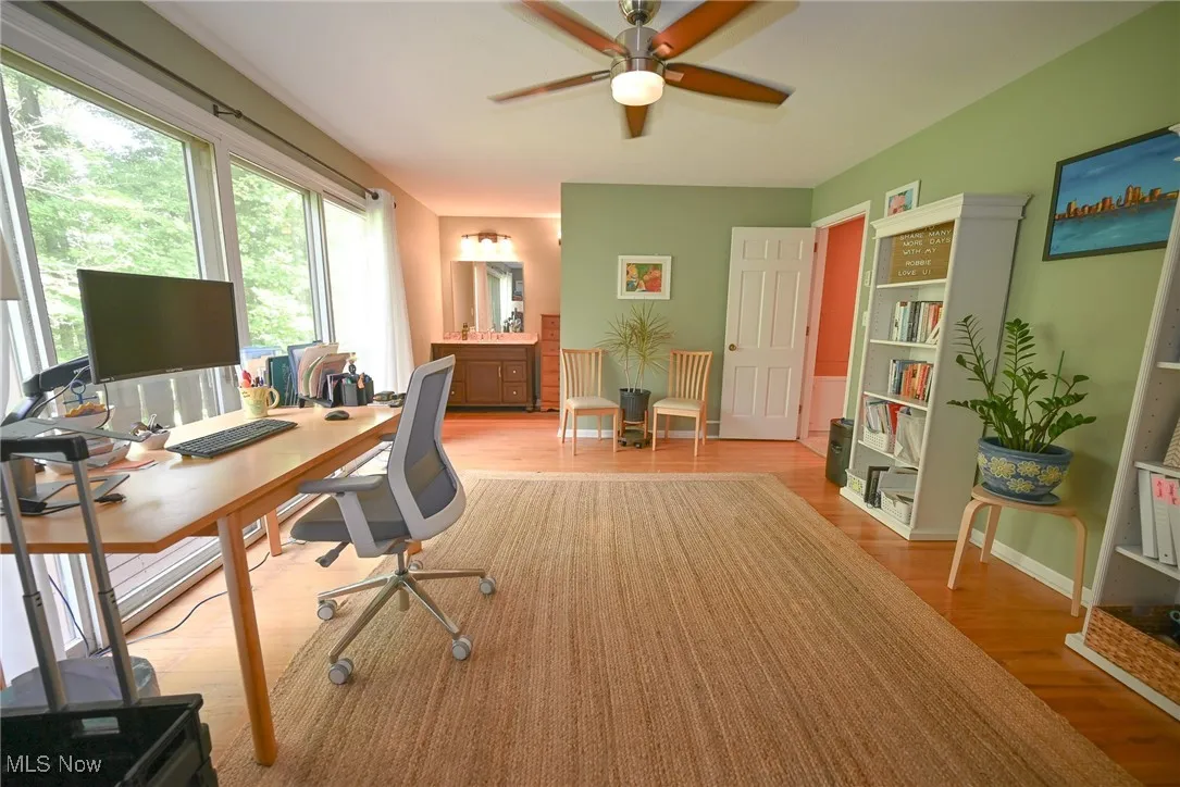 Office featuring light wood finished floors and a ceiling fan