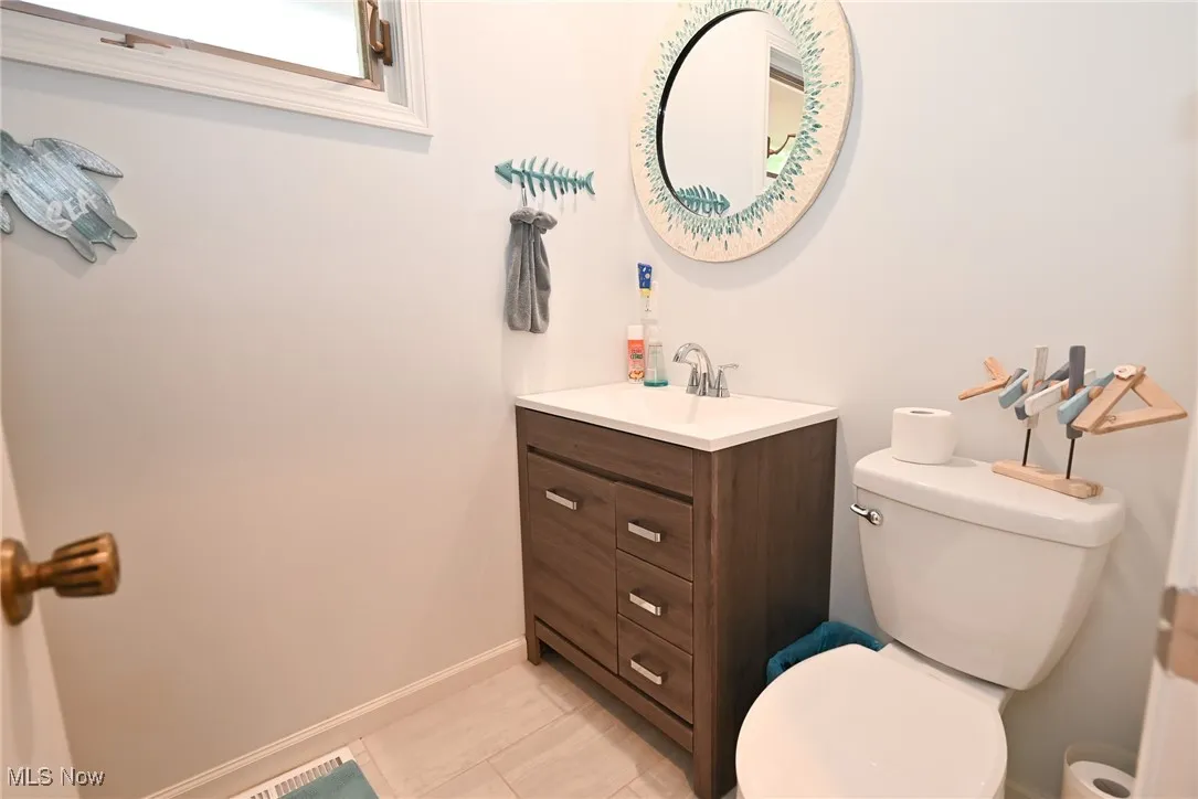Bathroom featuring vanity and light tile patterned floors
