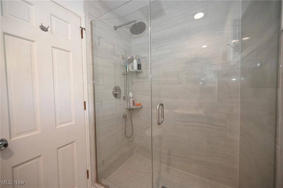 Full bath featuring a stall shower