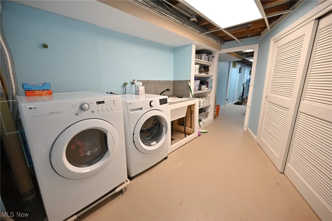 Laundry room with washing machine and dryer