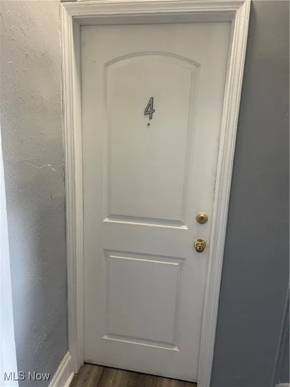 Detailed view of a textured wall and baseboards