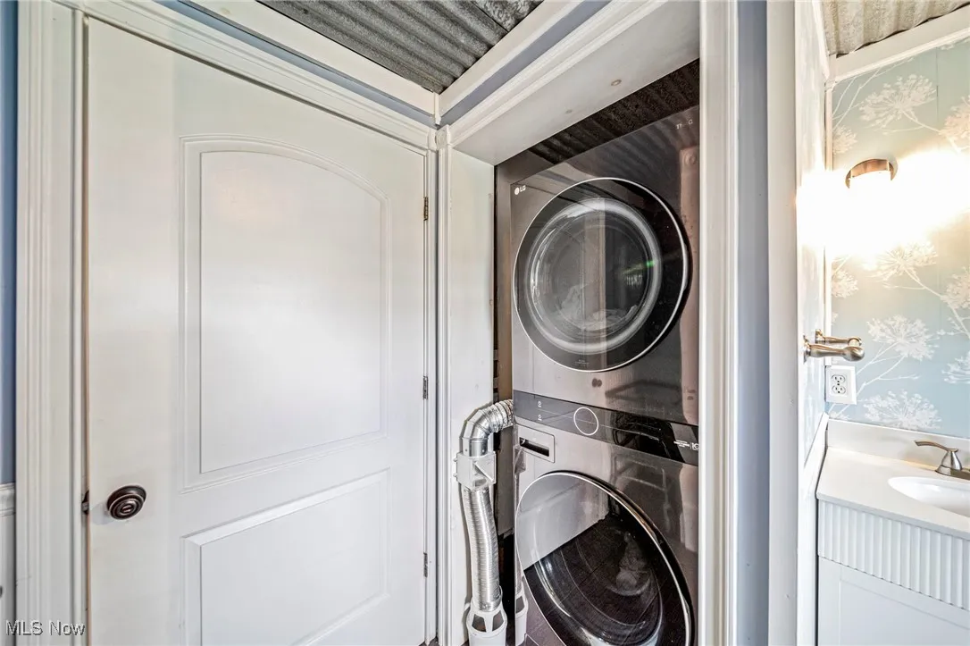 Laundry area featuring estacked washer and dryer