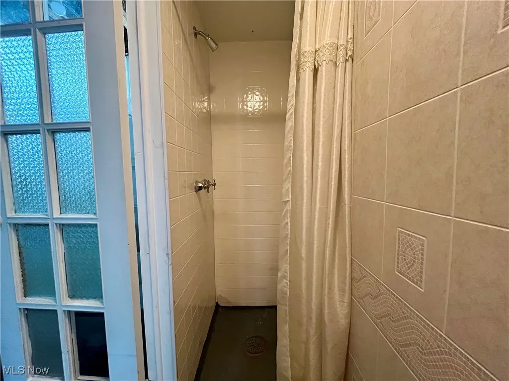 Bathroom featuring a shower stall