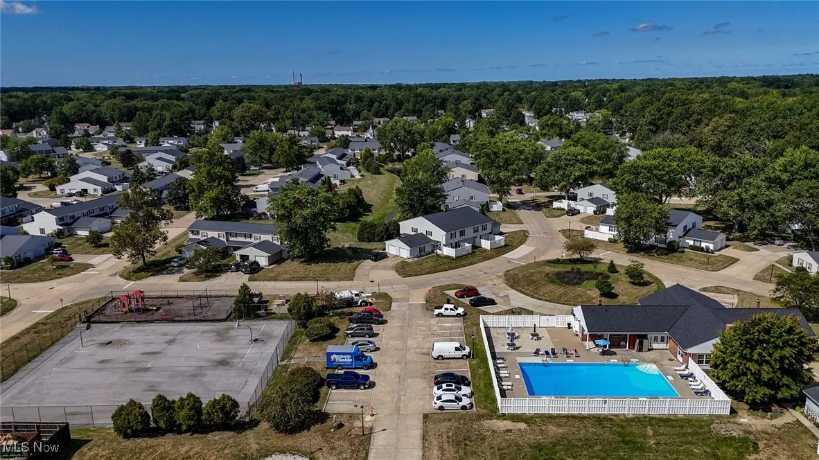 Aerial view of community pool, basketball court and playground