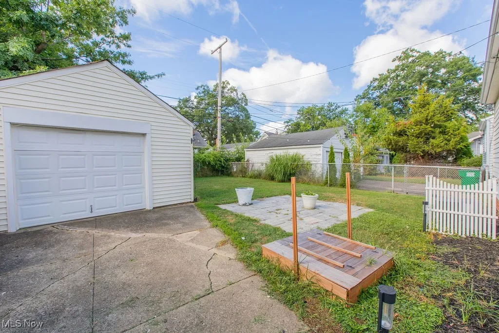 Detached garage featuring driveway