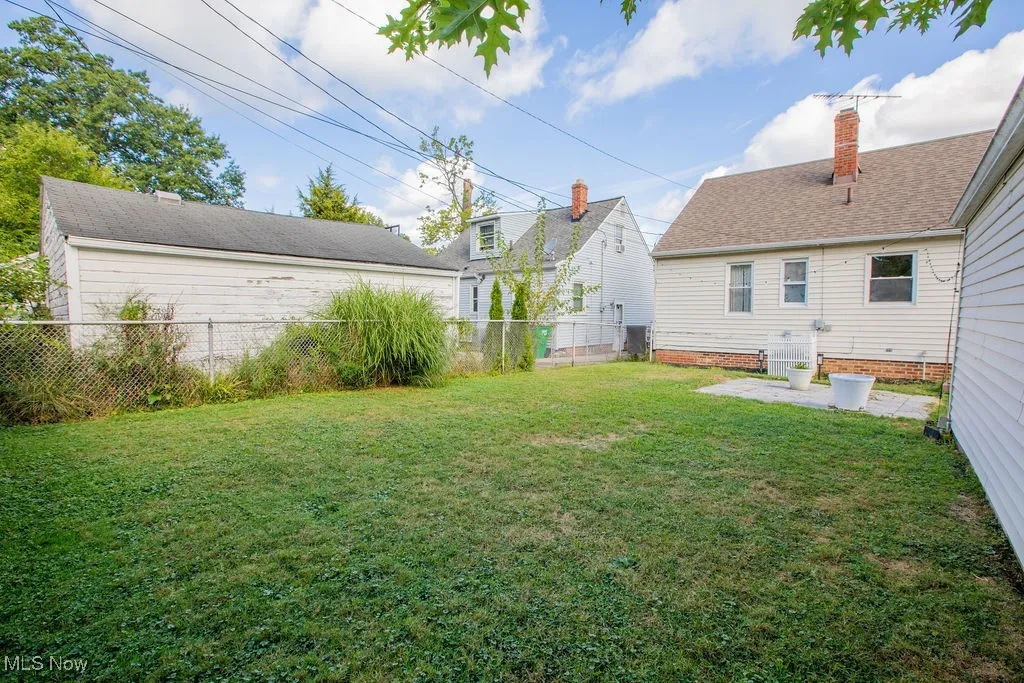 Fenced backyard with a patio area