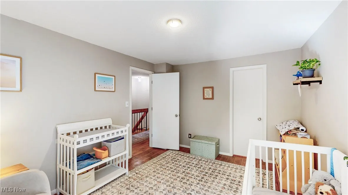 BR 2 - view from slider to hallway & walk-in closet w/access to attic for storage