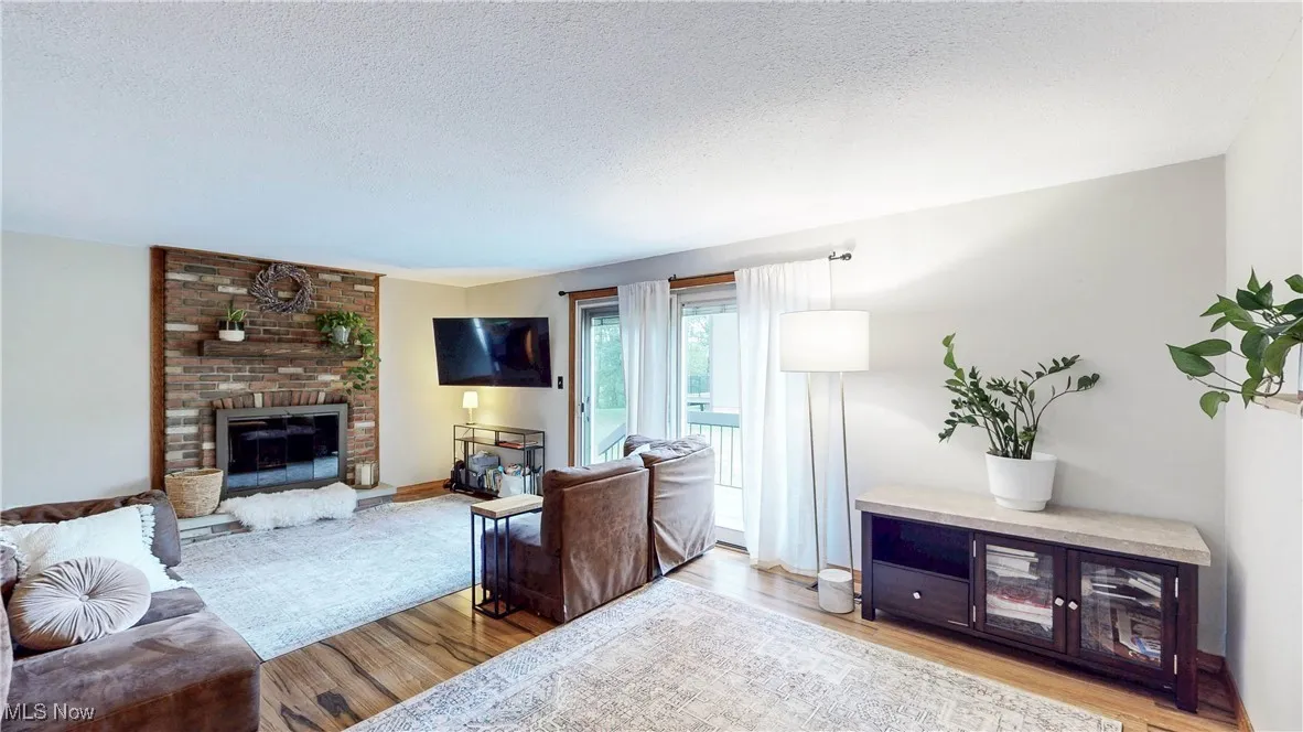 Comfortably appointed LR w/slider to rear deck and yard*WBFP w/glass doors*Mounted TV is included
