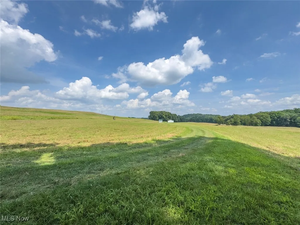 View of grassy yard with a view of countryside