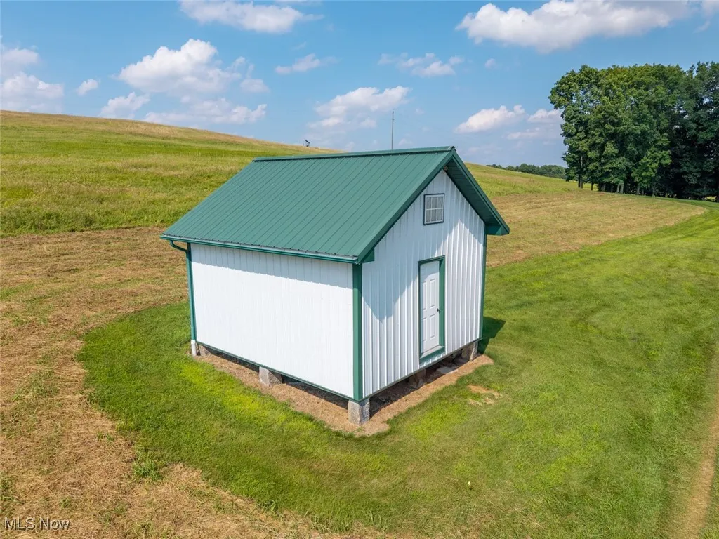 View of outdoor structure with a view of rural / pastoral area