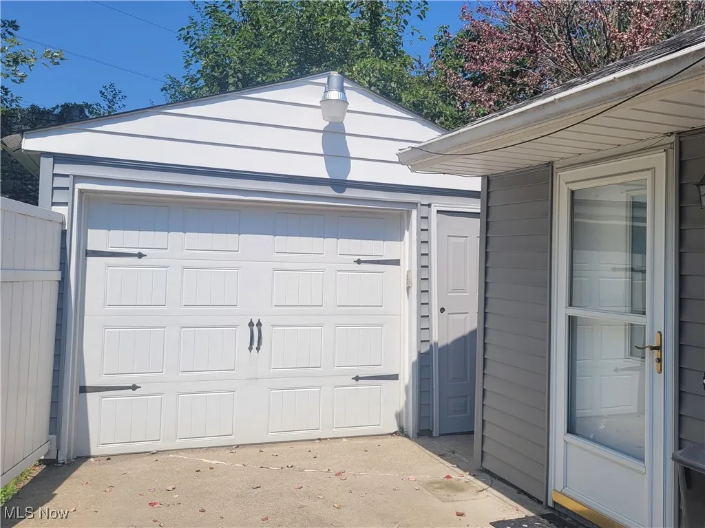 Garage featuring driveway