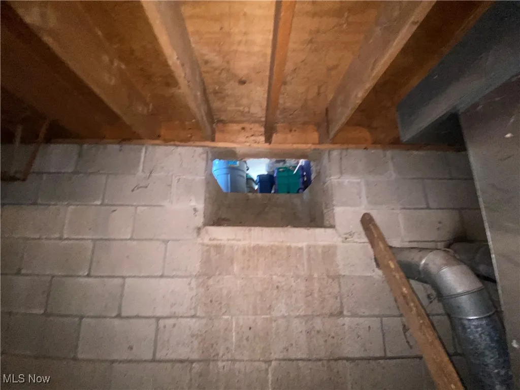 Basement view of wood shoot coming from garage