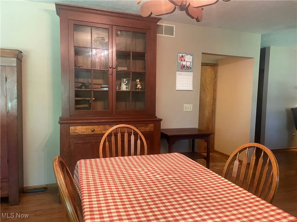 Dining area with wood finished floors