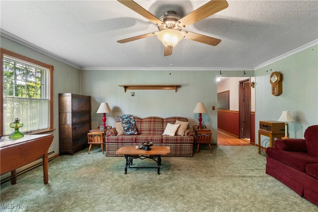 Family room with windows overlooking the treed backyard