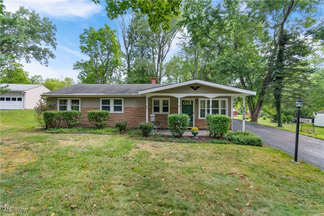 Single story home featuring a porch