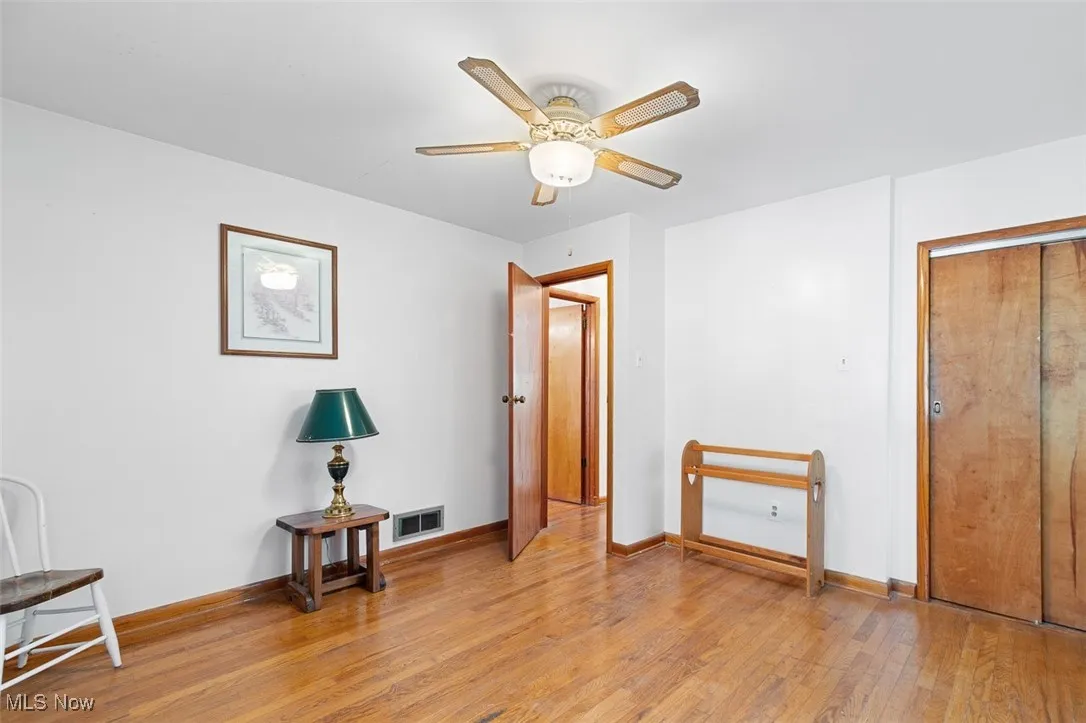 Unfurnished bedroom featuring light wood finished floors and ceiling fan