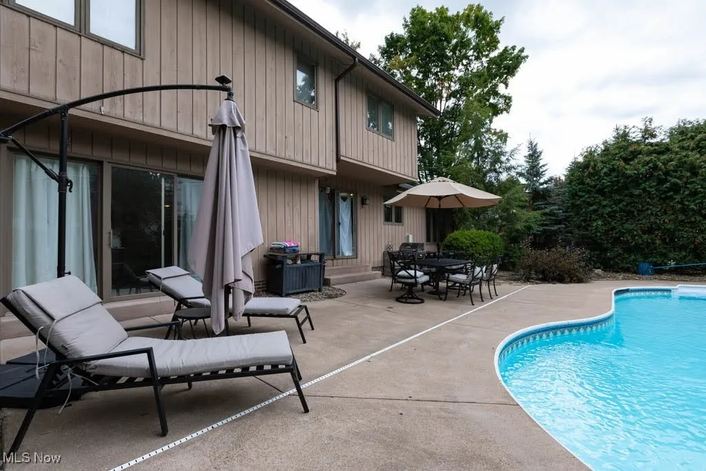Swimming pool featuring a patio area and outdoor dining area